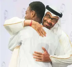  ?? WAM ?? Shaikh Mohammad Bin Zayed congratula­tes a representa­tive from the African Leadership Academy, South Africa, winner of the Global High Schools Prize (Sub-Saharan Africa).