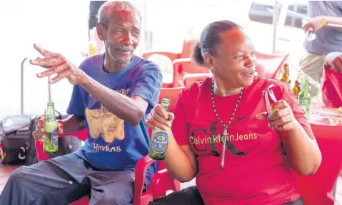  ?? PHOTOS BY GLADSTONE TAYLOR/MULTIMEDIA PHOTO EDITOR ?? Homez Stennett (left) and Julian Myrie react during a World Cup viewing session at Sonia’s Place on the Terrace on Waltham Park Road Sunday.