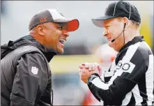  ?? Don Wright ?? The Associated Press Cleveland Browns coach Hue Jackson talks with line judge Mike Spanier as his team plays the Steelers on Sunday in Pittsburgh. The Browns lost 33-18 and Jackson was fired on Monday.