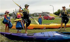  ?? PHOTO: JAMIE SMALL/FAIRFAX NZ ?? Singaporea­n tourist James Goh and his family prepare for an afternoon of seal spotting on kayaks at Kaikoura.