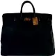  ??  ?? Hermès, circa  - Bagage haut à courroie , cuir grainé noir - Provenance Jane Birkin et Serge Gainsbourg - Estimation :   -   €.