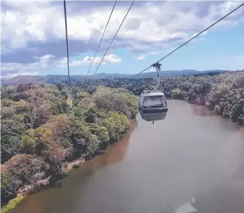  ?? Picture: KEITH WOODS ?? Skyrail Rainforest Cableway near Cairns rides high above the landscape.