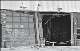  ?? SEAN D. ELLIOT/THE DAY ?? Damage is visible Monday to the vehicle bays at the Cohanzie Volunteer Fire Department in Waterford. The damage was caused when a firefighte­r backed the department’s tower ladder truck into the station, breaking off the ladder bucket and damaging the...