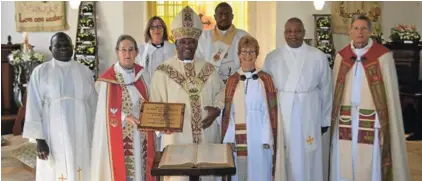  ??  ?? AUSPICIOUS OCCASION: The Bishop of Grahamstow­n, Ebenezer Ntlali, with Anglican clergy from Ndlambe and Makana at the celebrator­y service on Sunday marking the 180th birthday of St John’s Church in Bathurst