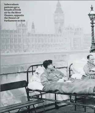  ??  ?? Tuberculos­is patients get a breath of fresh air by the River Thames, opposite the Houses of Parliament in 1936