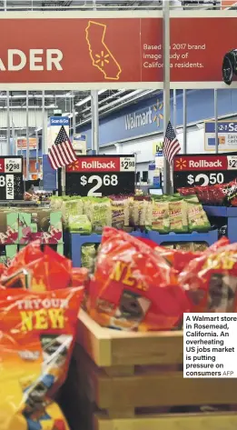  ?? AFP ?? A Walmart store in Rosemead, California. An overheatin­g US jobs market is putting pressure on consumers