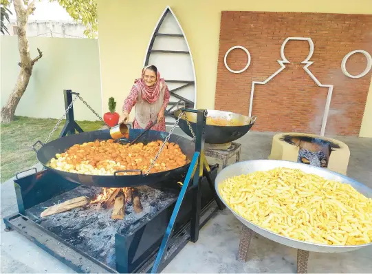  ?? VEG VILLAGE FOOD ?? More than 5 million followers tune in to a web series where they can watch Amar Kuar cook food from the simple setup in her family’s courtyard in her village in India.