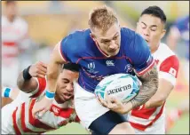  ??  ?? Russia’s Kirill Golosnitsk­iy breaks through to score the opening try during the Rugby World Cup Pool A game at Tokyo Stadium between Russia and
Japan in Tokyo, Japan on Sept 20. (AP)