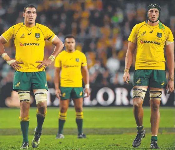  ?? Picture: AAP IMAGE ?? A dejected Rory Arnold, Will Genia and Adam Coleman after the loss to Scotland.