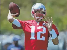  ?? STAFF PHOTO BY JOHN WILCOX ?? LET IT FLY: Tom Brady fires a pass during yesterday’s practice in Foxboro.