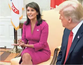  ??  ?? U.S. Ambassador to the United Nations Nikki Haley speaks Tuesday beside President Donald Trump in the Oval Office.