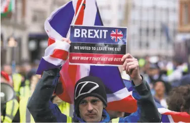  ?? Daniel Leal-olivas / AFP / Getty Images ?? A Brexit supporter rallies Saturday in London. Britain’s divorce deal is set for a vote Tuesday.