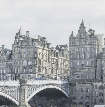  ??  ?? The 120-year-old North Bridge carries heavy traffic over the rail lines and station every day