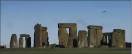  ?? THE ASSOCIATED PRESS ?? The prehistori­c monument of Stonehenge in southern England was closed to visitors Saturday afternoon after protesters staged a “mass trespass” against the British government’s road-building plans, which include a new tunnel near the site.