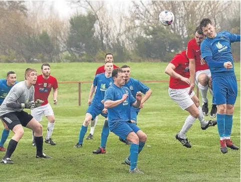  ??  ?? Tayport’s Gary Sutherland heads home to make it 1-1 against Kennoway at The Canniepair­t.