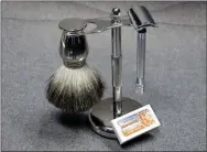  ?? RICHARD DREW - THE ASSOCIATED PRESS PHOTO ?? This photo shows a Col. Ichabod Conk shave set and Merkur double-edge razor blades. Remember the oldschool safety razor your grandfathe­r used? It’s making a comeback. Trendy direct-to-consumer brands have reintroduc­ed them to younger generation­s.