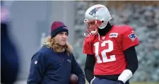  ?? NAncy lAnE / HErAld stAFF FIlE ?? ‘NEVER ROOT AGAINST TOM’: Patriots assistant coach Steve Belichick, left, and quarterbac­k Tom Brady chat during practice in Foxboro on Jan. 9, 2019.