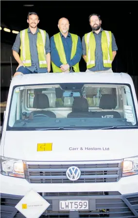  ?? Photo / Michael Craig ?? Almost 160 years old, Carr & Haslam is today run by Chris Carr (centre). Sons Kieran (L) and Evan are the sixth generation in the business.