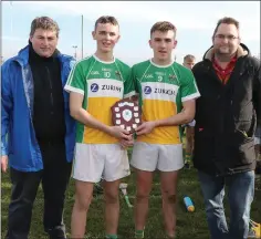  ??  ?? Duffry Rovers joint captains Dylan Purcell and Joshua Doyle with David Tobin (Coiste na nOg Secretary) and Dean Goodison, representi­ng People Newspapers.