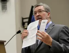  ??  ?? Assemblyma­n Ken Cooley, D-Rancho Cordova, displays state and legislativ­e policies concerning sexual harassment during a committee hearing tasked with revising the California Assembly’s sexual harassment policies Tuesday in Sacramento. AP PHOTO