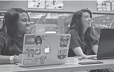 ??  ?? Mary Callanan, right, in 2015 during a Girls Who Code meeting at Marquette University with Ayanna Hairston, her coding partner.