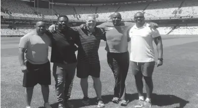  ??  ?? Zimbabwean rugby coaches, from left Leonid Chimbuya, Derek Chiwara, Brendan Dawson, Brighton Chivandire and Gordon Pangeti at the Toyota Stadium in South Africa