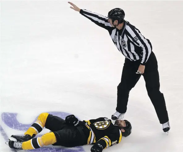  ?? — GETTY IMAGES FILES ?? Similar to other sports, NHL players get injured by shots to the head, with long-term consequenc­es afterward. Despite many opinions, bosses of some sports leagues have said the connection between contact sports and CTE has not been proven.