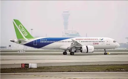  ?? BLOOMBERG PIC ?? The C919, which will compete with Boeing Co’s 737 and the Airbus SE A320, is a symbol of China’s civil aerospace ambitions.