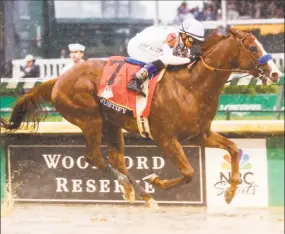  ?? Ron Garrison / TNS ?? Justify, with Mike Smith up, was all alone at the finish in the 144th running of the Kentucky Derby on Saturday at Churchill Downs in Louisville, Ky.