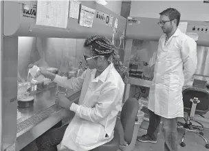  ??  ?? Lab automation engineer Chigozie Nri prepares nutrients to feed cells, as research director Nicholas Legendre looks on, in the laboratory of cultured meat startup New Age Meats, which has produced cell-based pork in San Francisco. A growing number of startups are making cellbased or cultured meat that doesn’t require slaughteri­ng animals.