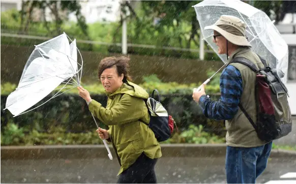  ?? AFP ?? The 12-day election campaign was marked by near-constant rain and driving winds, and the weather remained wet on voting day