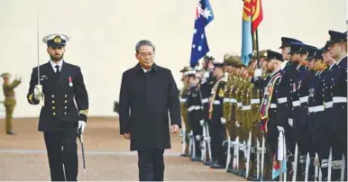  ?? REUTERSPIC ?? Li inspecting a guard of honour outside the Australian Parliament House in Canberra yesterday. –