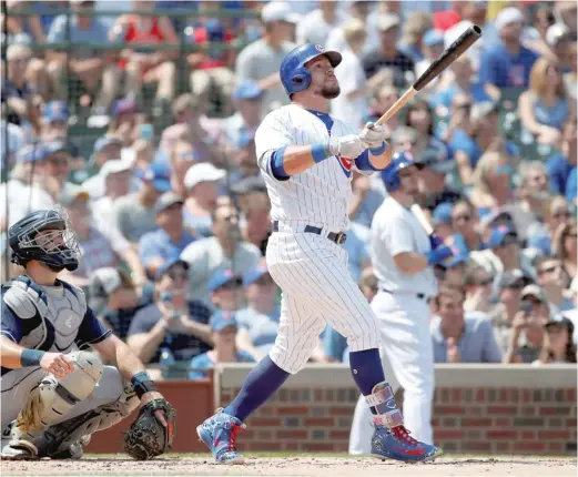  ?? AP ?? Kyle Schwarber follows the flight of his home run during the Cubs’ five-run second inning Saturday against the Padres. It was his 20th homer of the season.