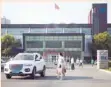  ??  ?? People walking past the building of Changchun Changsheng Biotechnol­ogy in Changchun in China’s northeaste­rn Jilin province. — AFP