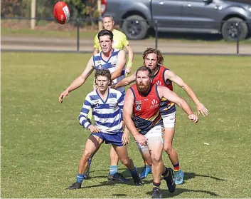  ?? ?? Neerim’s Matthew Pecoraro (top left)) and Christain Roberston Edgar contest the ball with Longwarry’s Sam Blake (top right) and John Werner.