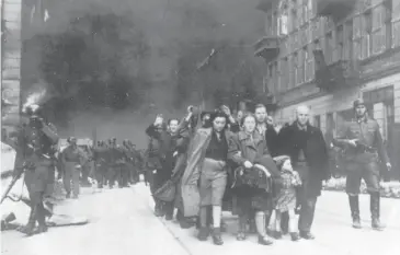  ?? ?? In this 1943 file photo, a group of Polish Jews are led away for deportatio­n by German SS soldiers during the destructio­n of the Warsaw Ghetto by German troops after an uprising in the Jewish quarter ghetto by German soldiers on April 19, 1943. Almost 80 years after the Holocaust, about 245,000 Jewish survivors are still living across more than 90 countries, according to the report by the New York-based Conference on Jewish Material Claims Against Germany.