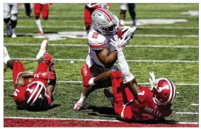  ?? JUSTIN CASTERLINE / GETTY IMAGES ?? Ohio State’s J.K. Dobbins runs for a touchdown Saturday during the second quarter against the Hoosiers at Memorial Stadium in Bloomingto­n, Indiana. Dobbins and fellow tailback Master Teague topped the 100-yard mark for OSU.