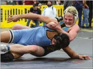  ?? CONTRIBUTE­D PHOTO BY KAREN VANNI ?? Monache High School’s Hunter Avila wrestles against Even Almaguer of Clovis North Friday, Feb. 15, in a CIF Central Section Masters Boys consolatio­n quarterfin­al match at Lemoore High School. Avila won, 7-5, by decision.