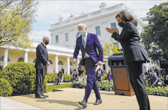  ?? Andrew Harnik The Associated Press ?? President Joe Biden, accompanie­d by Vice President Kamala Harris, right, and Attorney General Merrick Garland, left, departs Thursday after speaking about gun violence prevention in the Rose Garden at the White House.