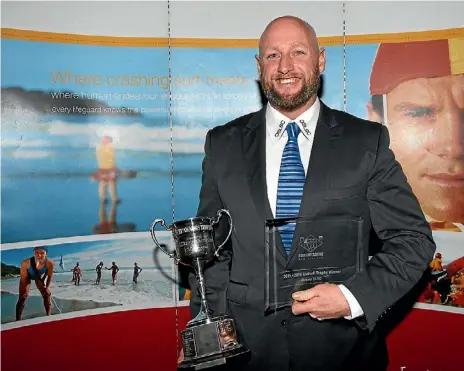  ?? SLSNZ ?? Orewa Surf Lifesaving member Tom Burgess with the Gudsell Trophy.