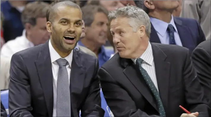  ?? AP Photo ?? The 76ers have reportedly offered Brett Brown, right, their long-vacant coaching job. Philadelph­ia has been searching for a coach since Doug Collins resigned in April.