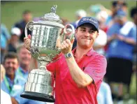  ?? CHRIS O'MEARA / AP ?? Justin Thomas poses with the Wanamaker Trophy after winning the PGA Championsh­ip on Sunday at Quail Hollow in Charlotte, North Carolina.