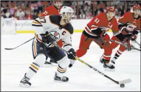  ?? Gerry Broome The Associated Press ?? Edmonton’s Connor McDavid (97) will record back-to-back 100-point seasons, but his team will miss the playoffs, weakening his claim to the Hart Trophy as league MVP.