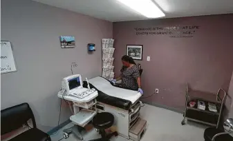  ?? Tony Gutierrez / Associated Press file photo ?? Marva Sadler, director of clinical services, prepares the operating room at theWholeWo­man's Health clinic in FortWorth in 2019.