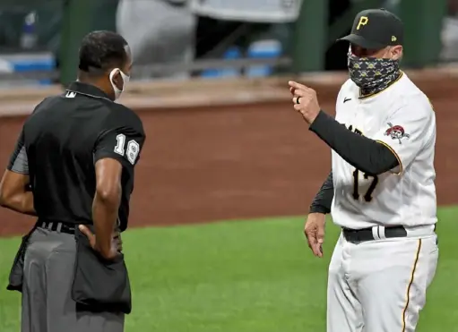  ?? Matt Freed/Post-Gazette ?? Pirates manager Derek Shelton argues with home plate umpire Ramon De Jesus in the seventh inning. De Jesus went on to throw Shelton out of the game Friday night at PNC Park.