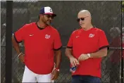  ?? JEFF ROBERSON — THE ASSOCIATED PRESS ?? Nationals manager Dave Martinez, left, talks with general manager Mike Rizzo during spring training practice on Feb. 17in West Palm Beach, Fla.