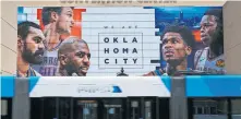  ?? [DOUG HOKE/ THE OKLAHOMAN] ?? The Cox Convention Center has a Thunder banner hanging on the south side opposite of the Chesapeake Energy Arena prior to the NBA Playoffs in August.