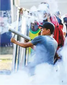  ?? AP ?? Protesters during clashes with police in Managua, Nicaragua, on Friday. The opposition said more than 20 people were wounded while a writers group said that at least 11 journalist­s were attacked while covering the demonstrat­ions.