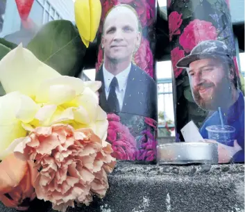  ?? DON RYAN/AP FILES ?? Candles with photos of Taliesin Namkai-Meche, right, and Ricky Best on them sit at a memorial for the two men late last month in Portland, Ore. Jeremy Christian, accused of stabbing the two men to death who tried to stop him from hurling anti-Muslim...