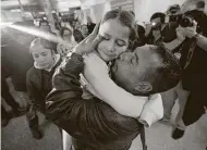  ?? Jason Armond / Tribune News Service ?? A father and a daughter are reunited in Los Angeles last January after they were separated under the Trump administra­tion’s zero-tolerance policy. President Joe Biden’s immigratio­n plan is much different from Trump’s.